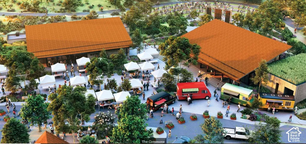 Two distinct buildings with pitched roofs, a landscaped courtyard, multiple vendor tents, and mobile food service units