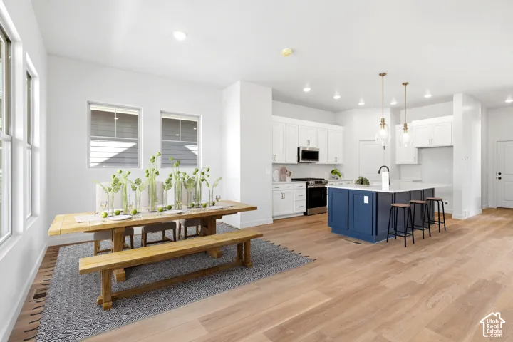 Open-concept living space featuring wood-finish flooring throughout