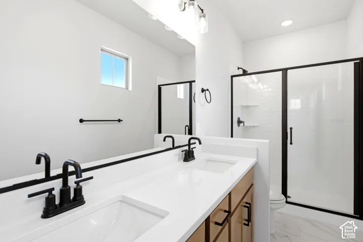 Dual vanity with undermount sinks and matte black fixtures