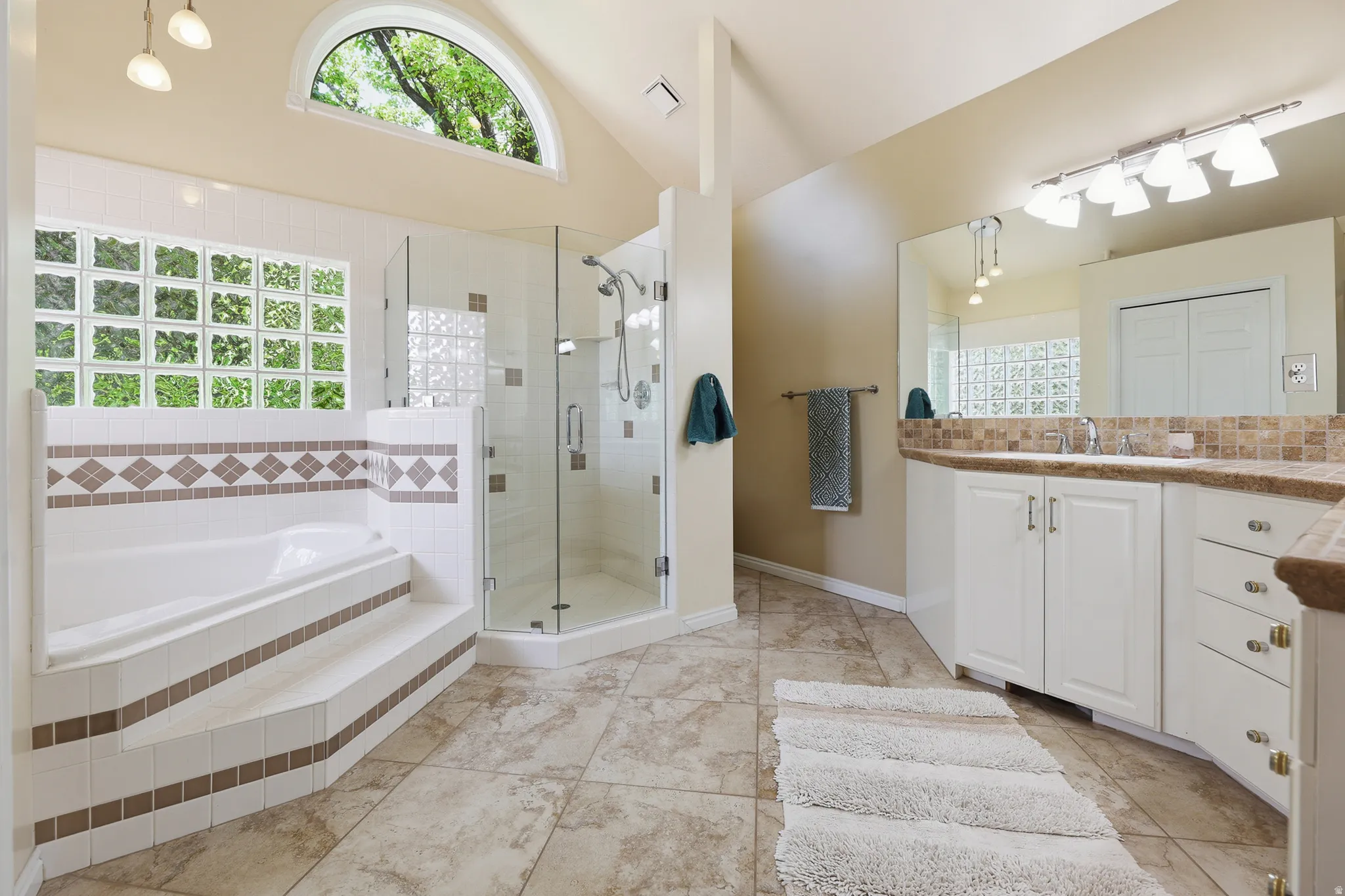 Large Primary Bathroom with heated floors and walk in closet.