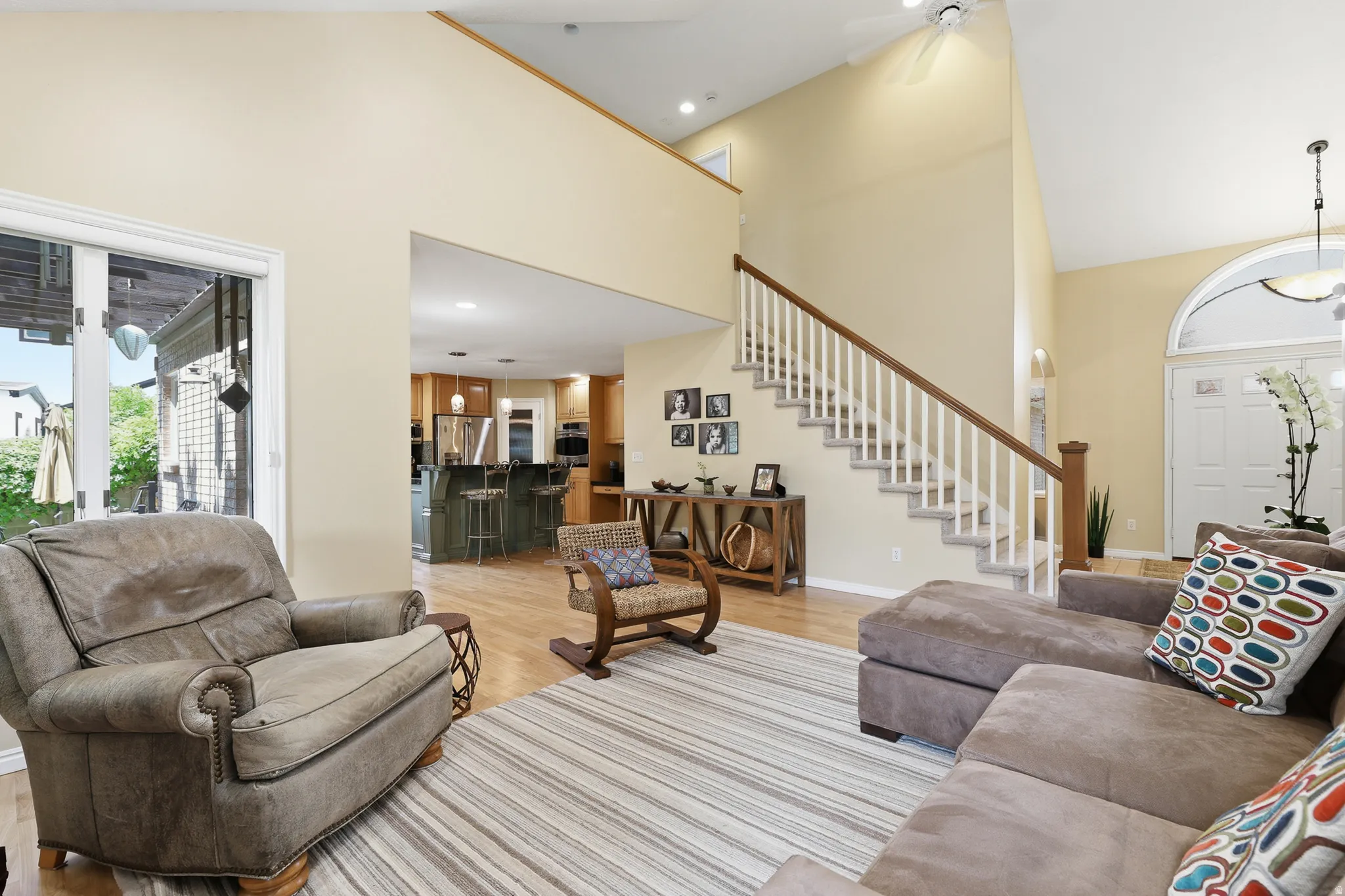 Living room with stairway to loft and two bedrooms
