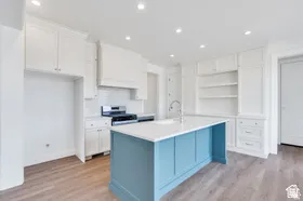 Classic white kitchen with lovely blue island