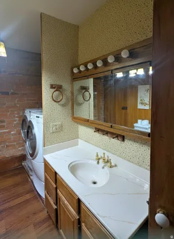 Bathroom vanity with a white countertop and integrated sink