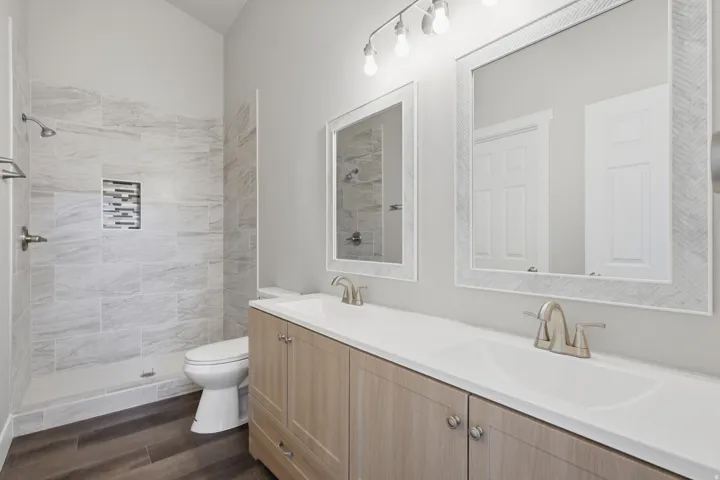 Double vanity with integrated sinks and brushed nickel faucets