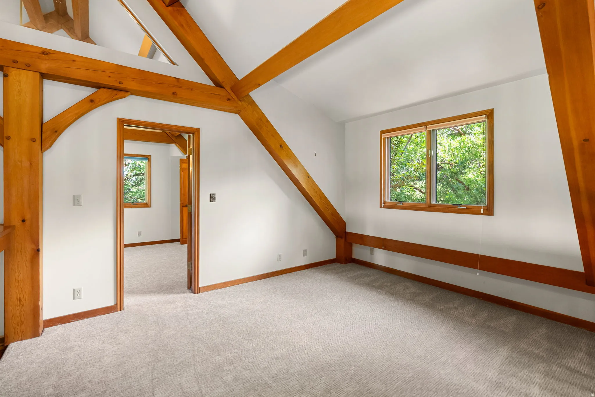 Exposed timber beams throughout this room