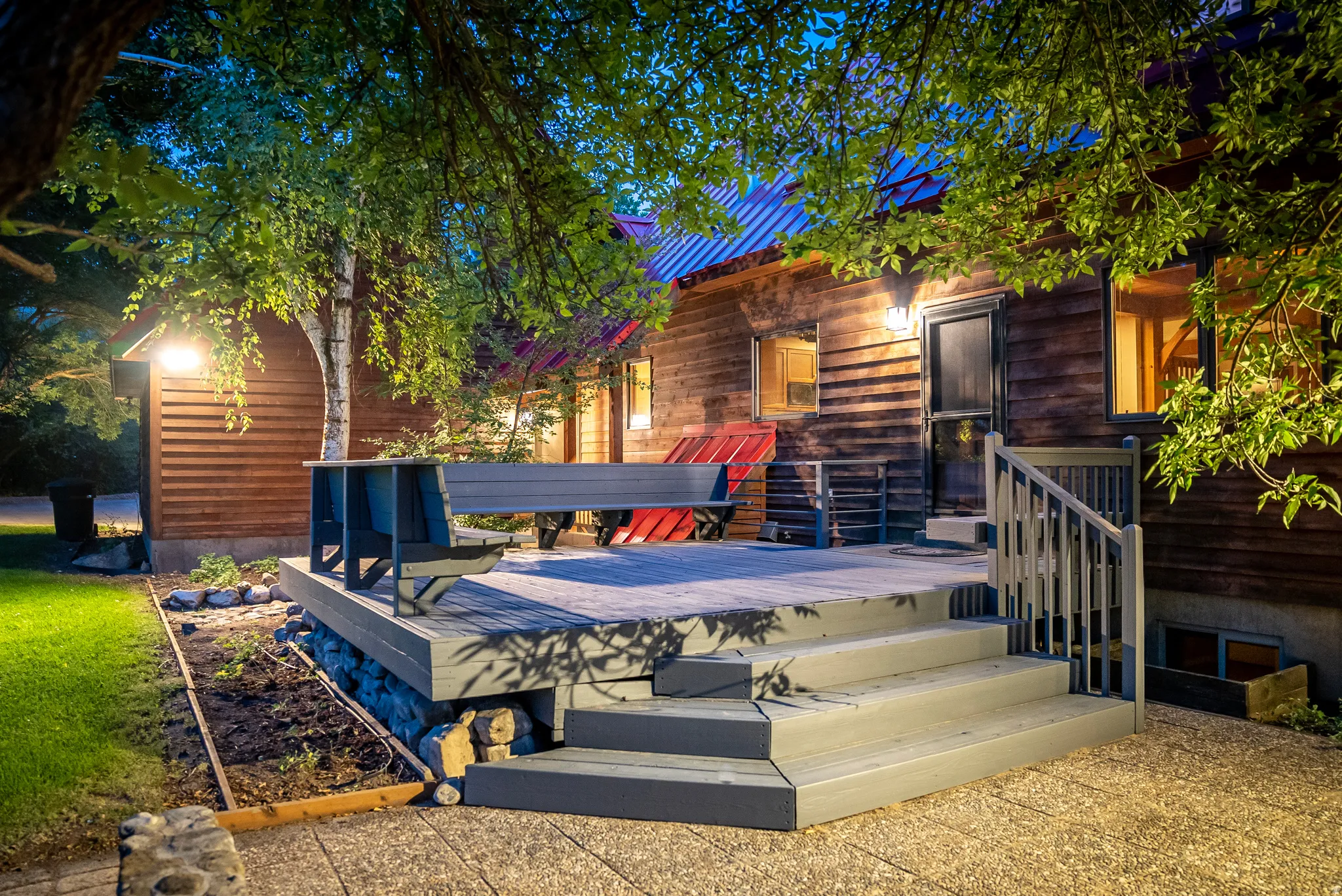 Spacious outdoor deck with tiered stairs and wood-finish railing