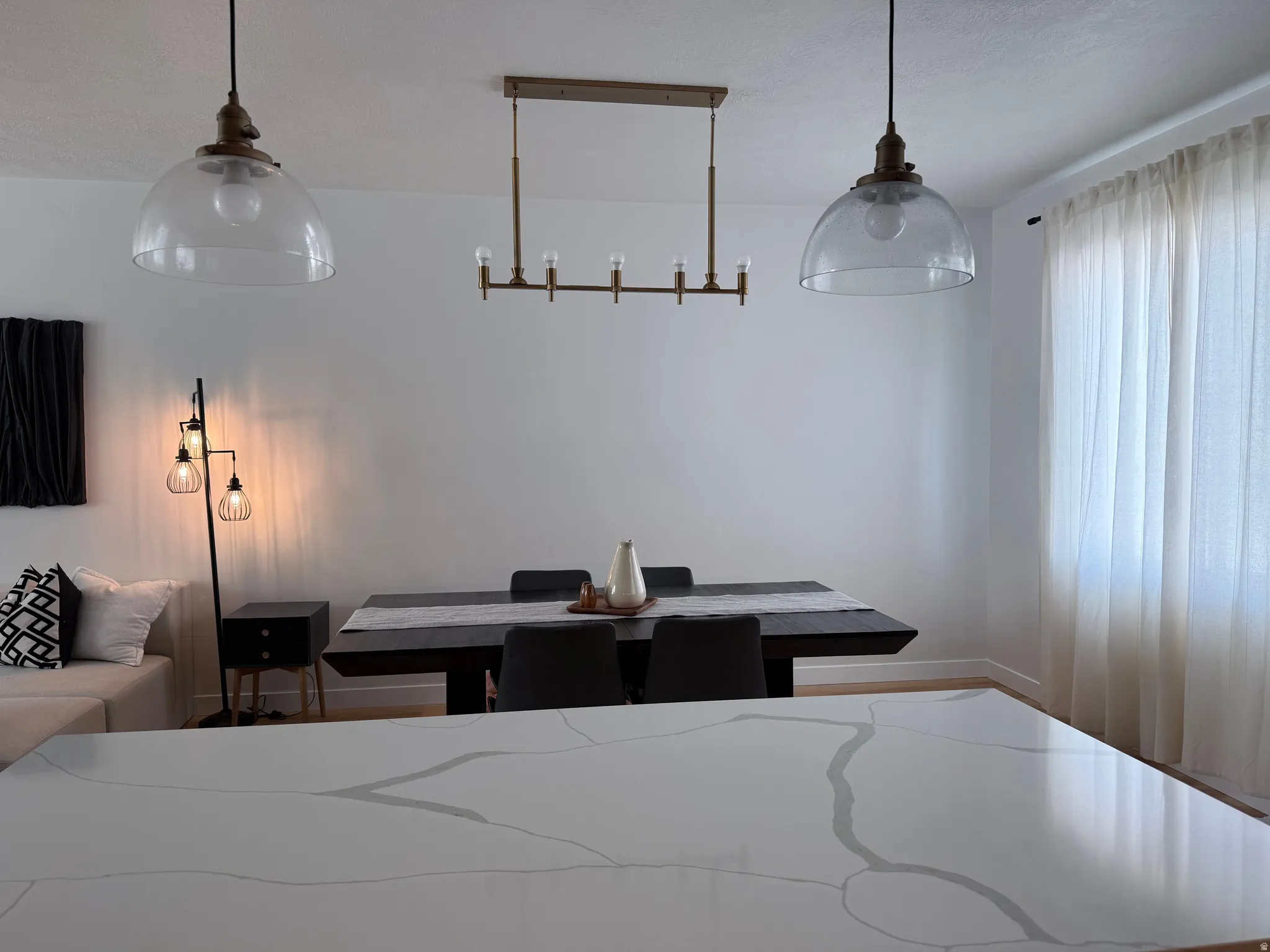 White quartz countertop featuring prominent gray veining