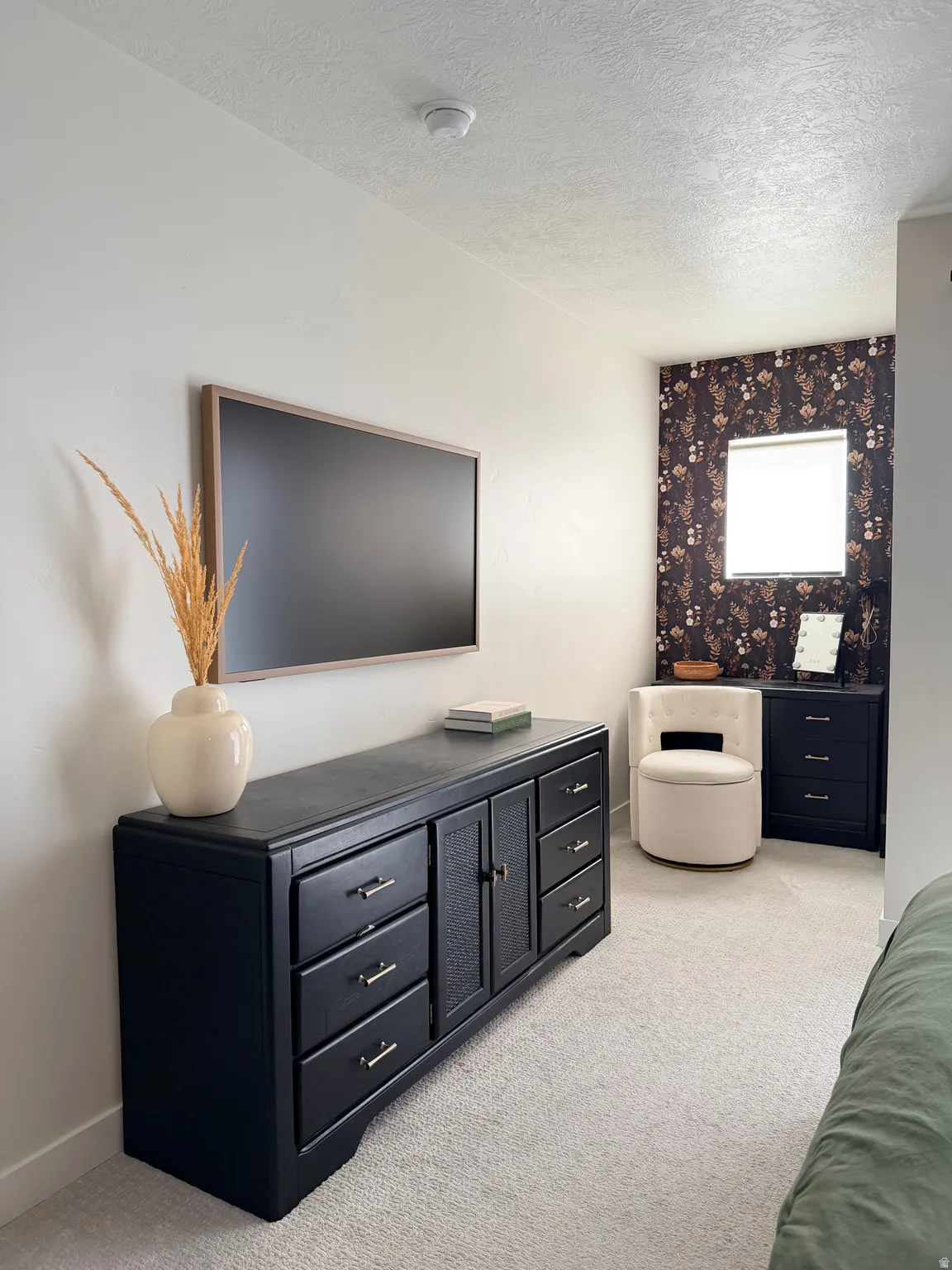 Neutral-toned carpeting extends throughout this interior space