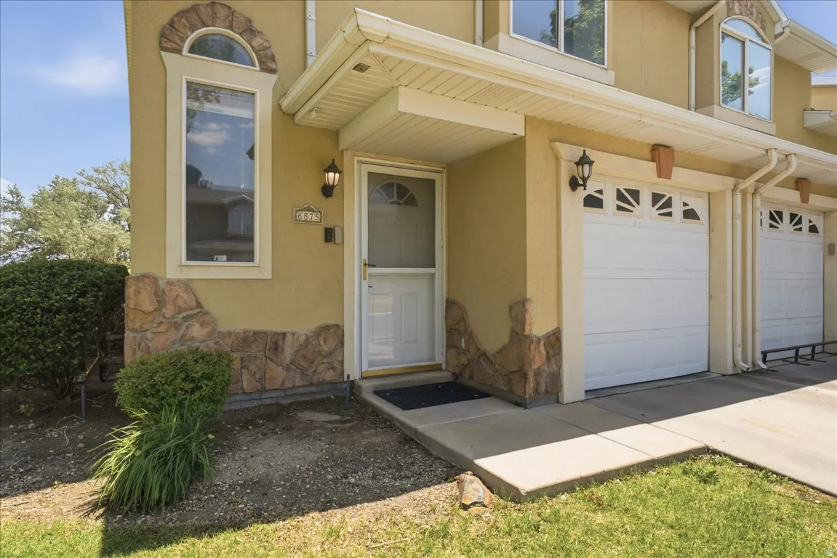 Stucco exterior with stone veneer accents