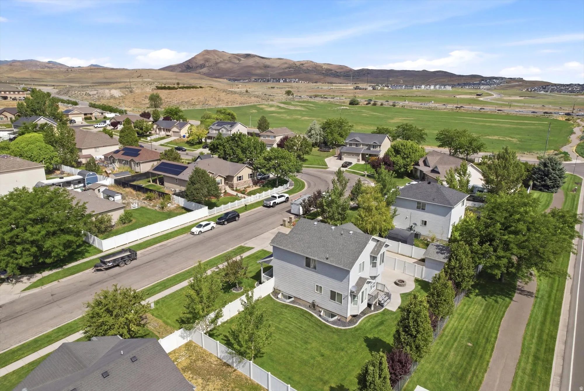 Residential neighborhood featuring single-family homes and a distant mountainous backdrop