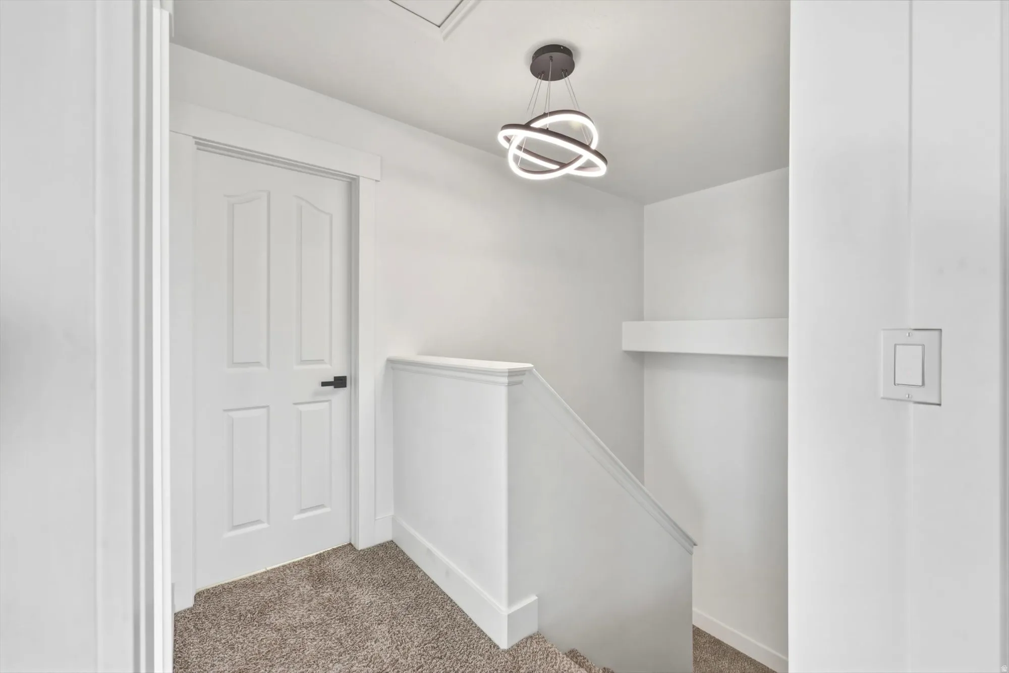 Upper landing with carpeted flooring