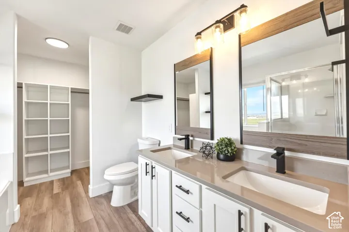 Dual vanity with integrated sinks, light-toned countertop, and matte black fixtures