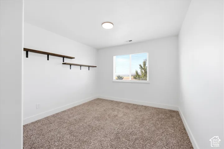 Neutral-toned carpeting paired with white walls