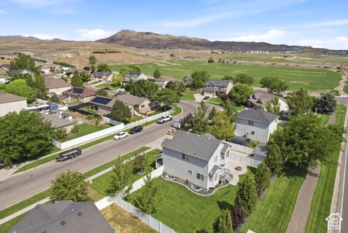 Residential neighborhood featuring single-family homes and a distant mountainous backdrop