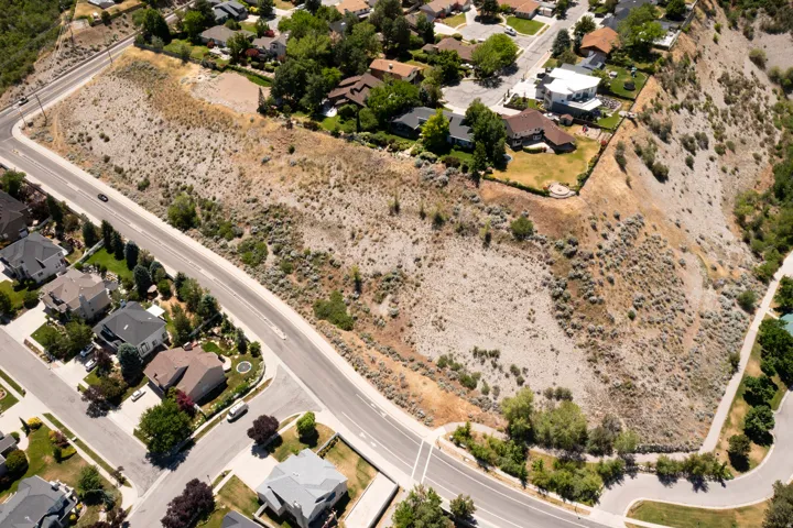 Elevated parcel featuring natural desert landscaping and paved road frontage