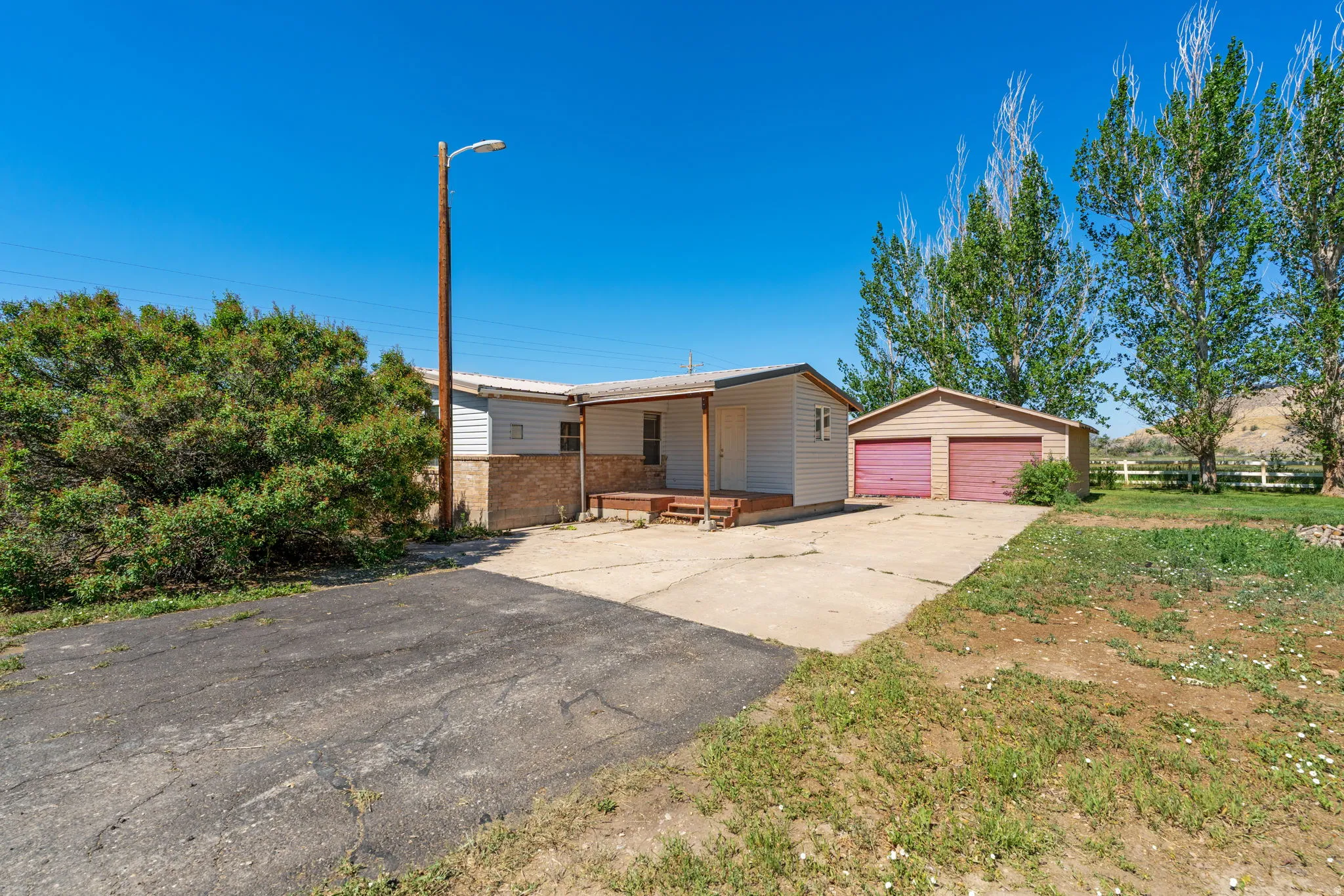 Manufactured home, 2nd home on property. Includes 2 car garage