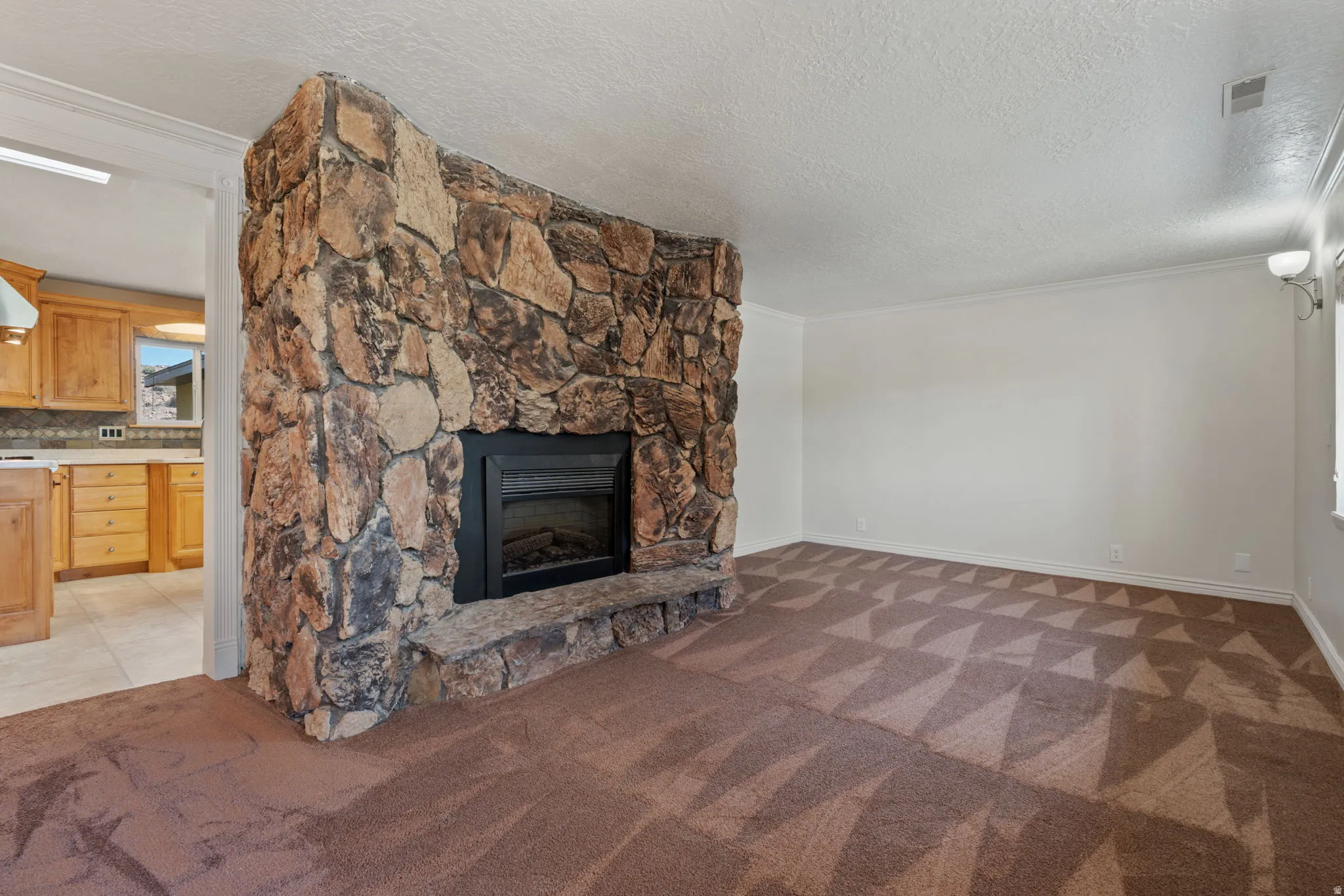 Formal living room leading to kitchen