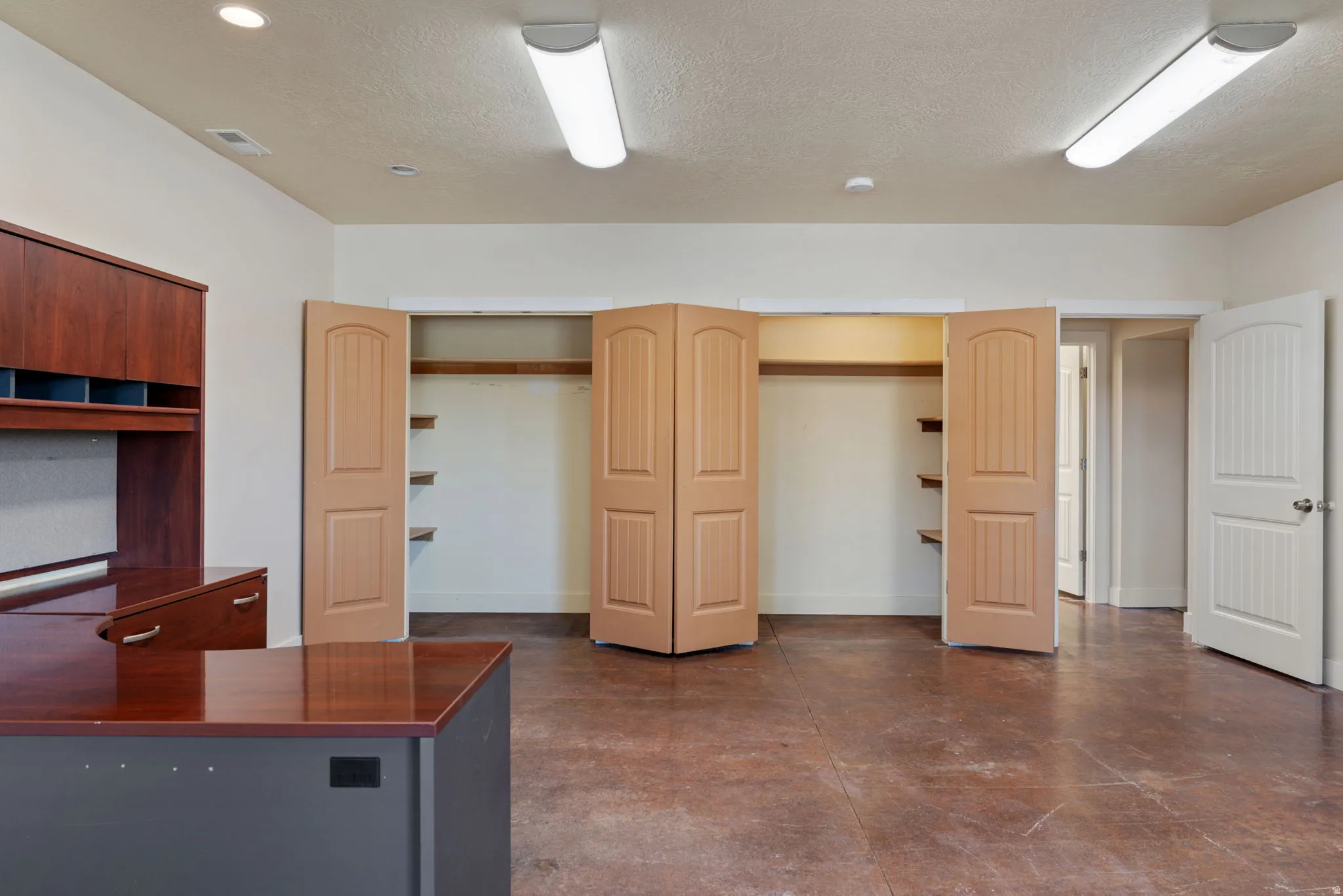 Huge office space/multipurpose area, just off the main entrance of the home. Easy for guests or clients to stop in without going through your home.