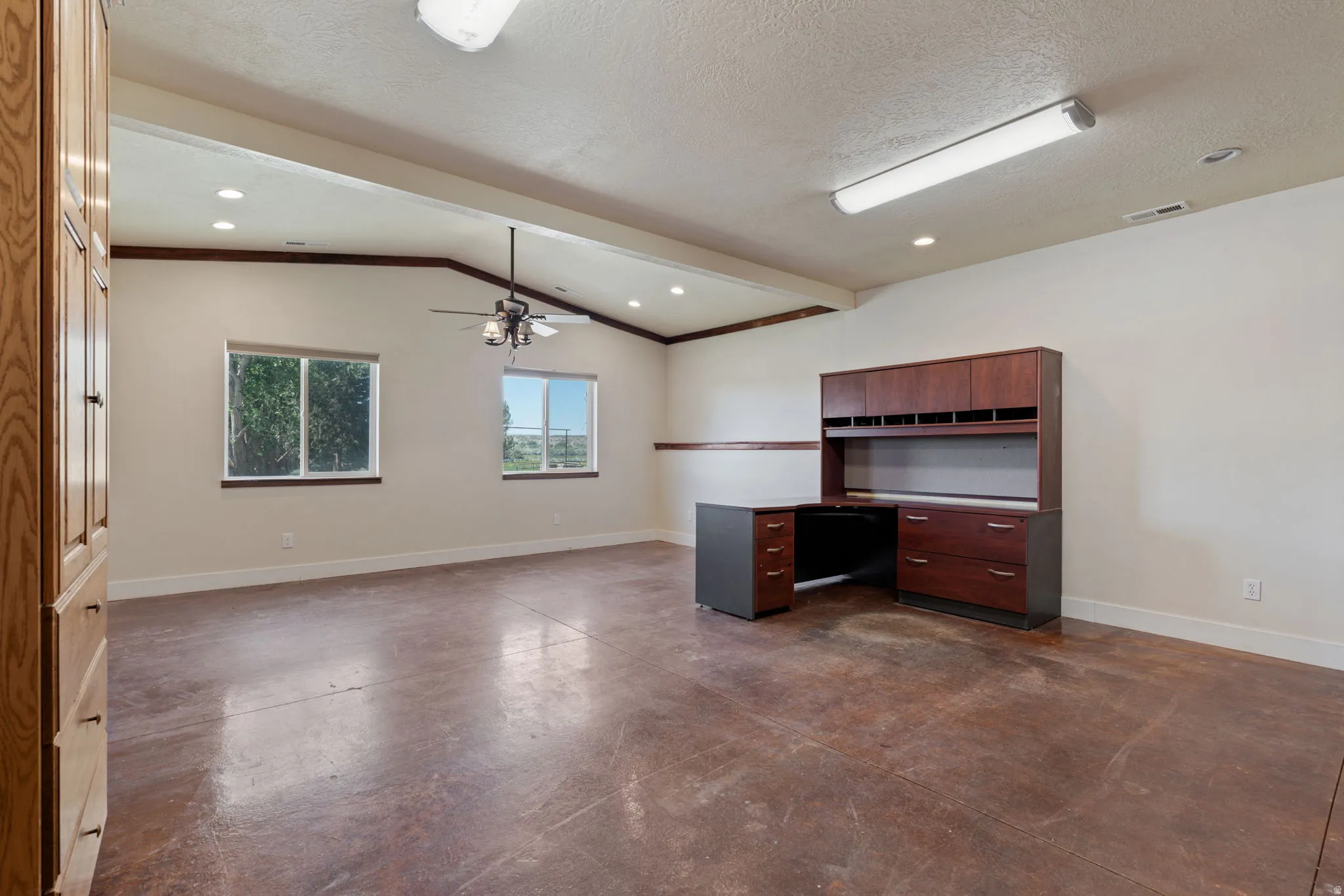 Huge office space/multipurpose area, just off the main entrance of the home. Easy for guests or clients to stop in without going through your home.