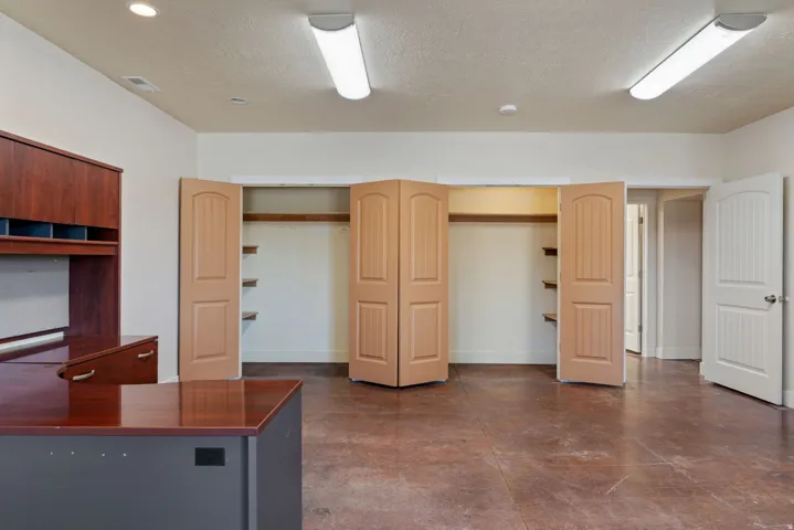 Huge office space/multipurpose area, just off the main entrance of the home. Easy for guests or clients to stop in without going through your home.