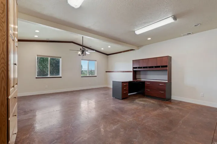 Huge office space/multipurpose area, just off the main entrance of the home. Easy for guests or clients to stop in without going through your home.