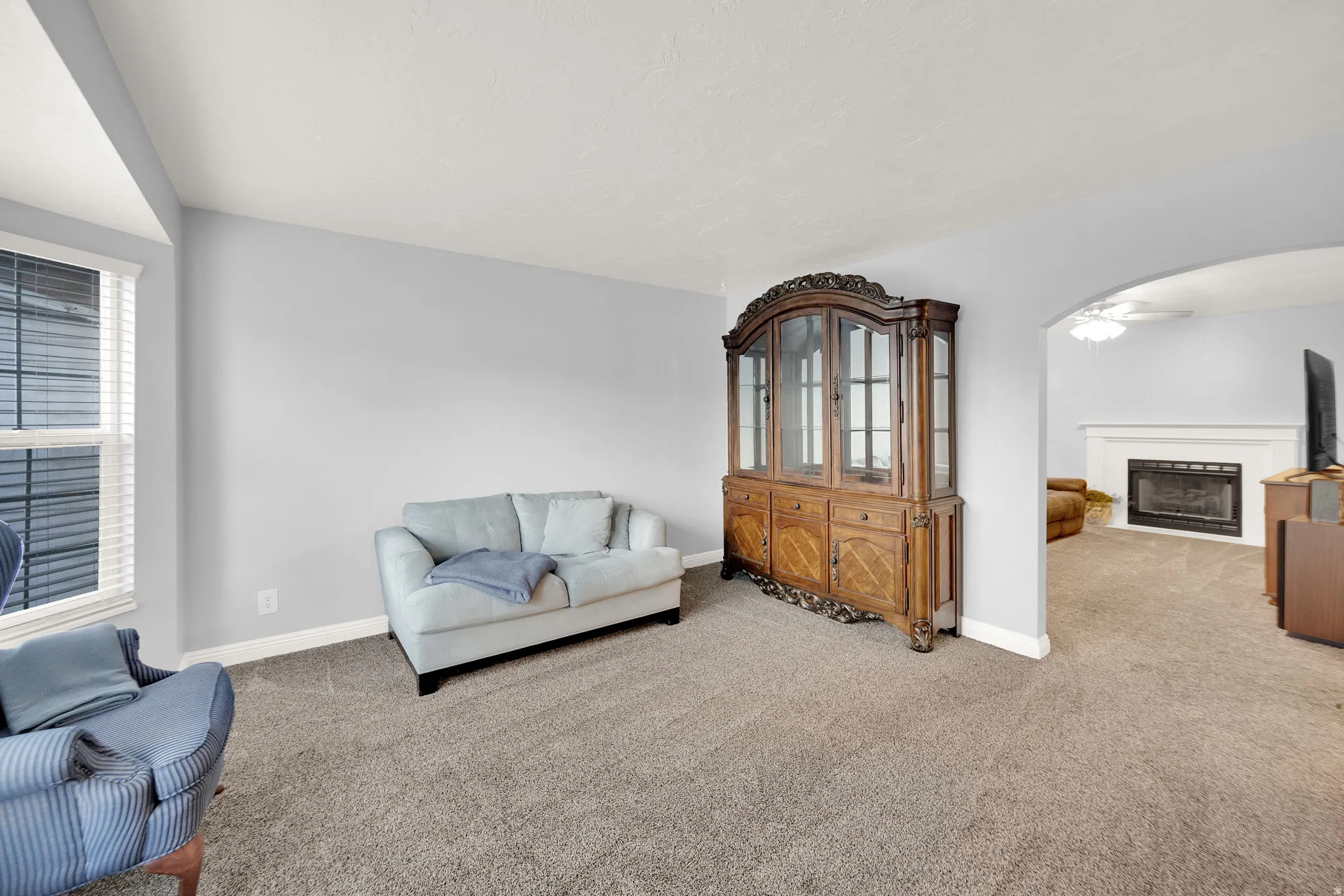 Carpeted interior space with light gray wall paint