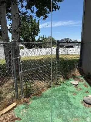 Chain-link fencing defining the property boundary