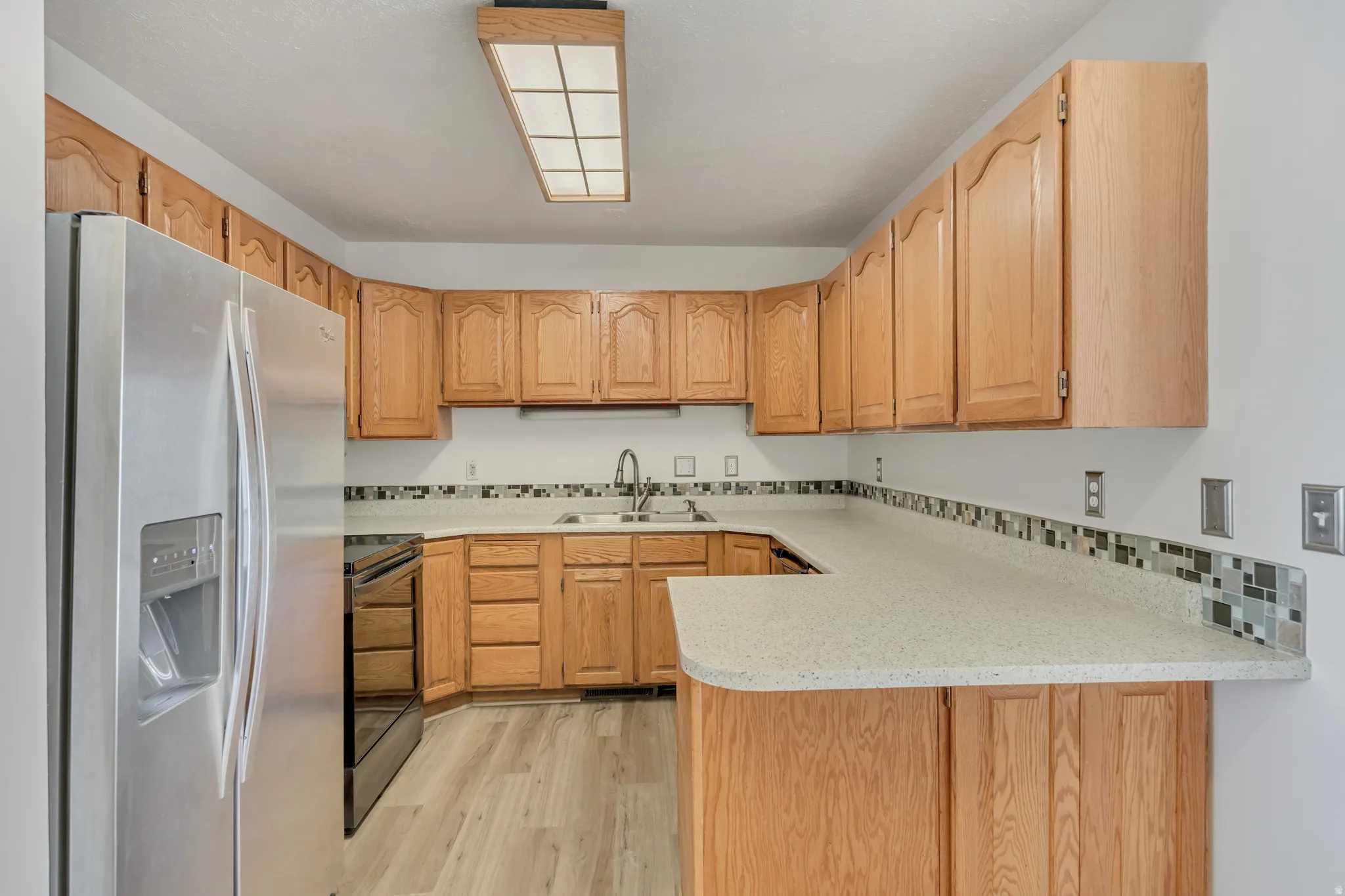 Kitchen with stainless fridge