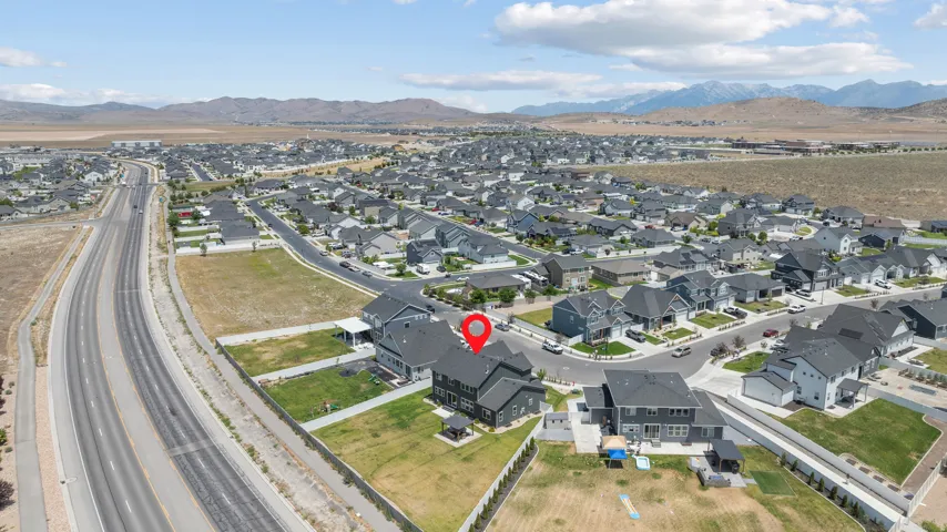 Aerial perspective showcasing a residential community with distant mountain ranges