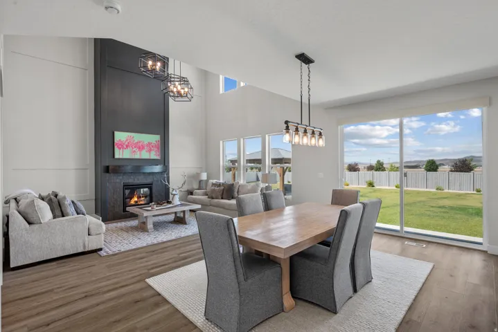 Spacious great room featuring high ceilings and wood-finish flooring