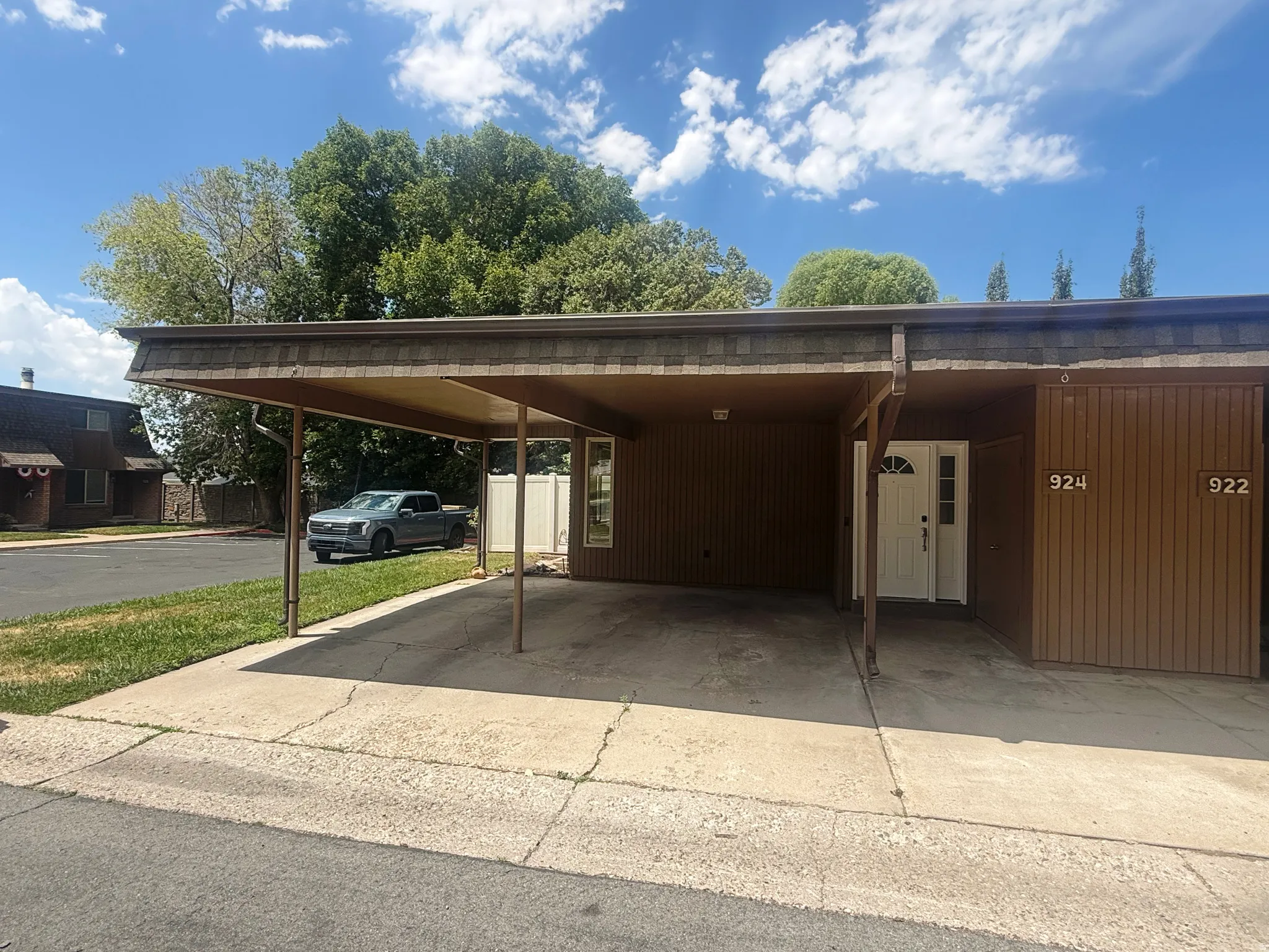 Covered carport parking for two vehicles