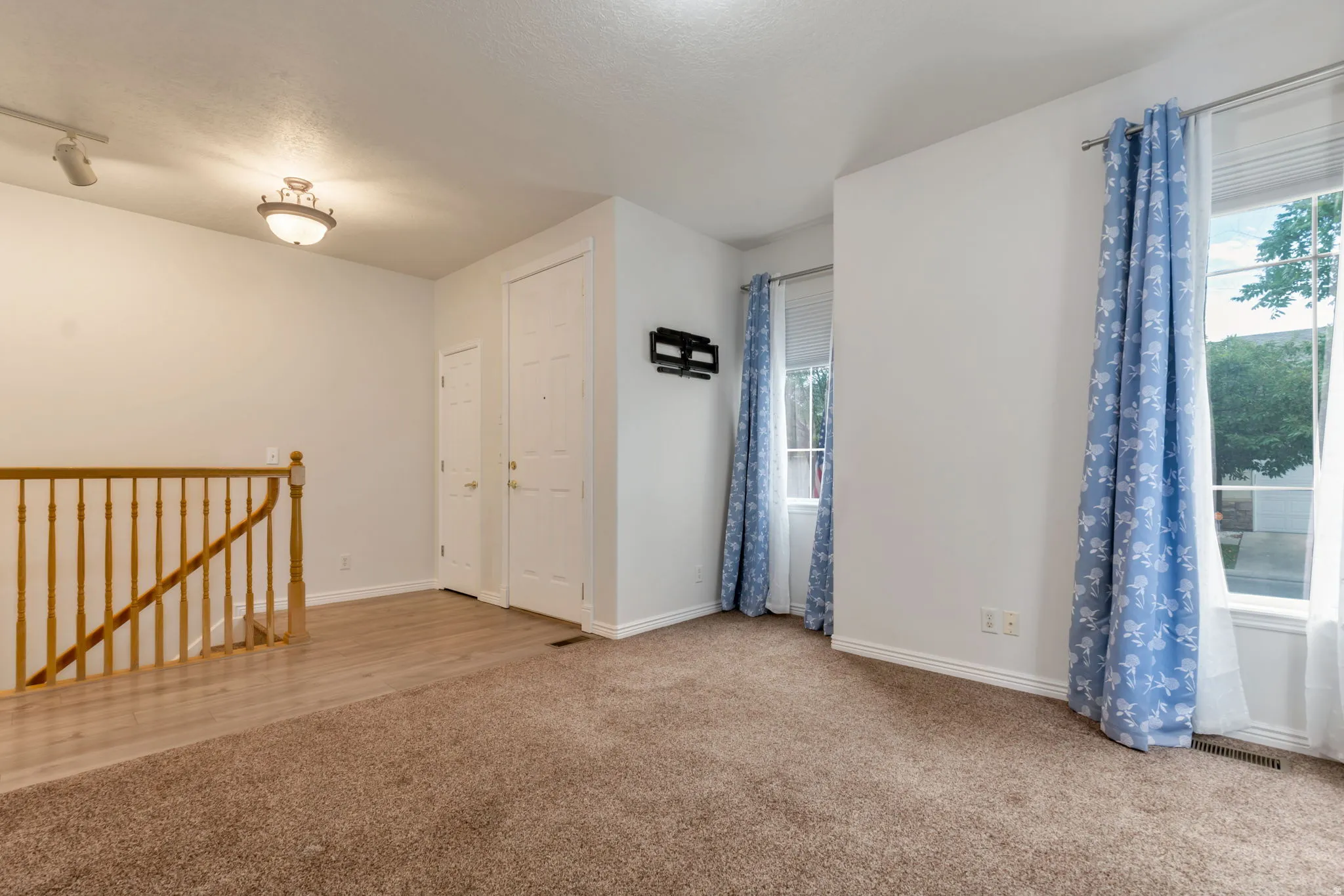 Front door into living room, staircase to basement