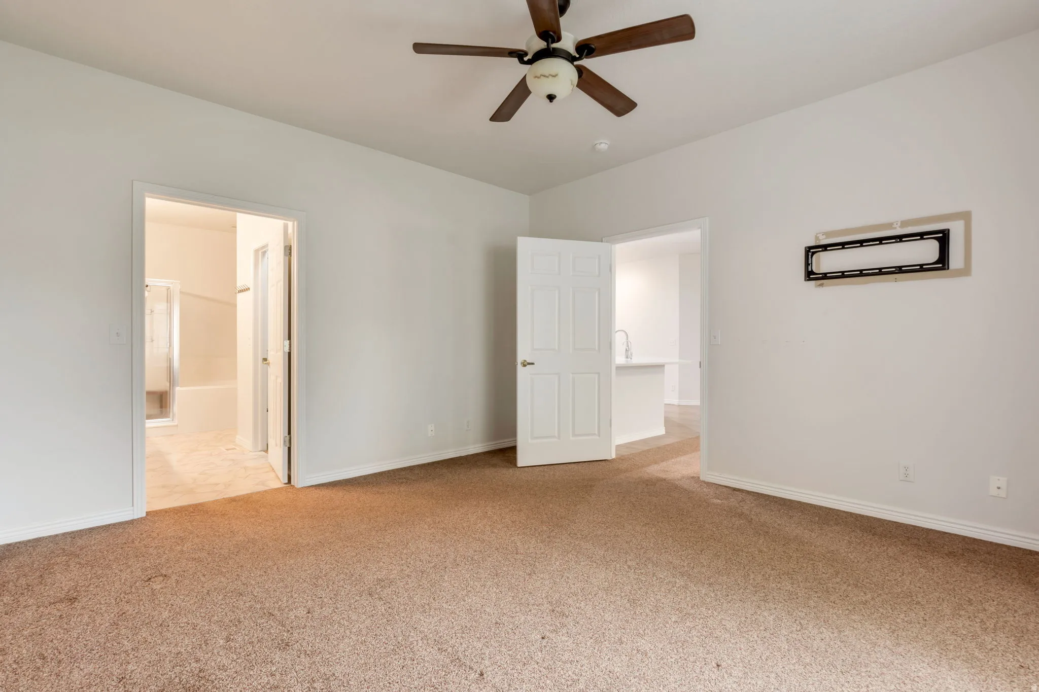 Primary bedroom with entrance to ensuite