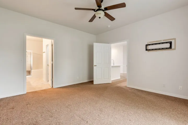 Primary bedroom with entrance to ensuite
