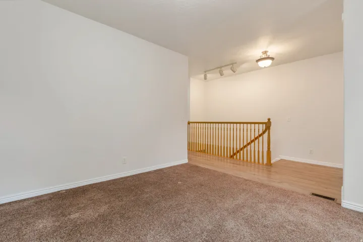 Expansive carpeted area with neutral wall tones