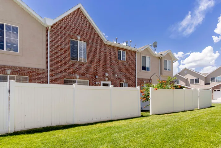 Wide open space behind townhome. Unit is the one with the open gate.