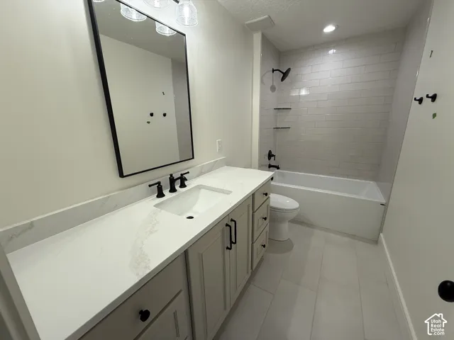 Bathroom featuring a vanity with a white countertop, undermount sink, and matte black fixtures