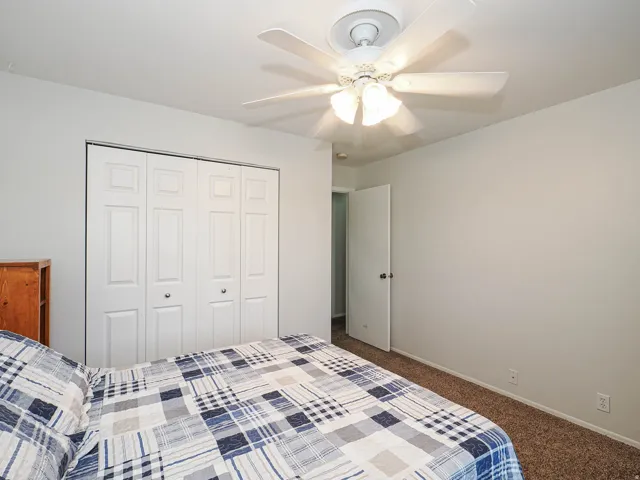 Room featuring neutral-toned walls and plush carpeting