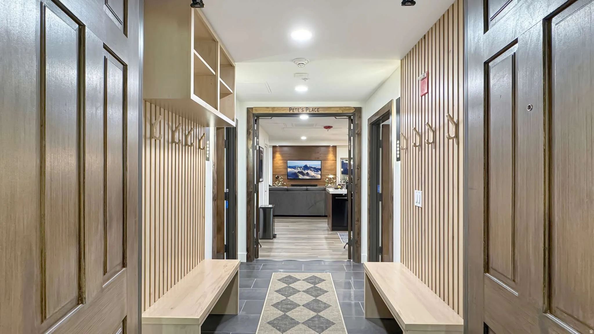 Entryway featuring slate tile flooring and a diamond-patterned runner
