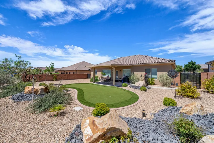 Back yard putting green and covered patio
