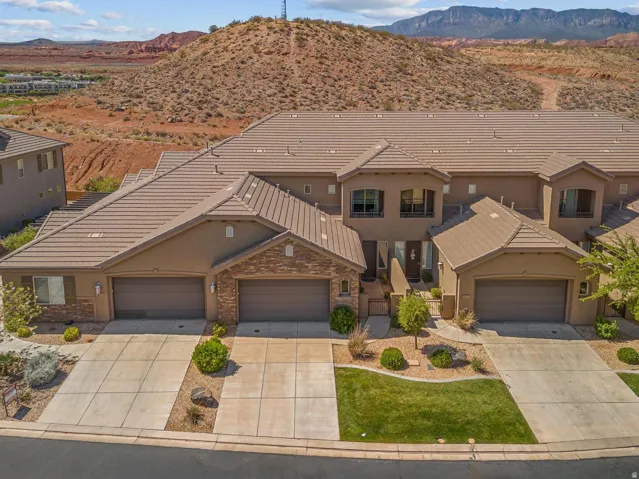 Multi-unit property with a stucco and stone veneer exterior