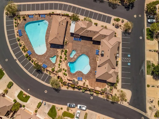 Community amenities featuring multiple swimming pools, a spa, and extensive sun decks