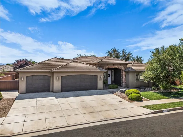 Single-story stucco exterior with a tile roof