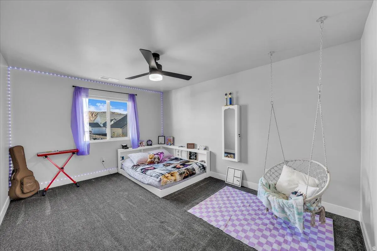 Room featuring dark gray carpeting and light gray walls