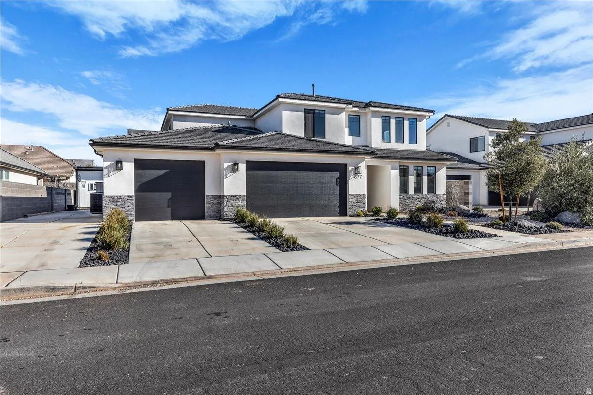 Contemporary stucco exterior with dark-framed windows