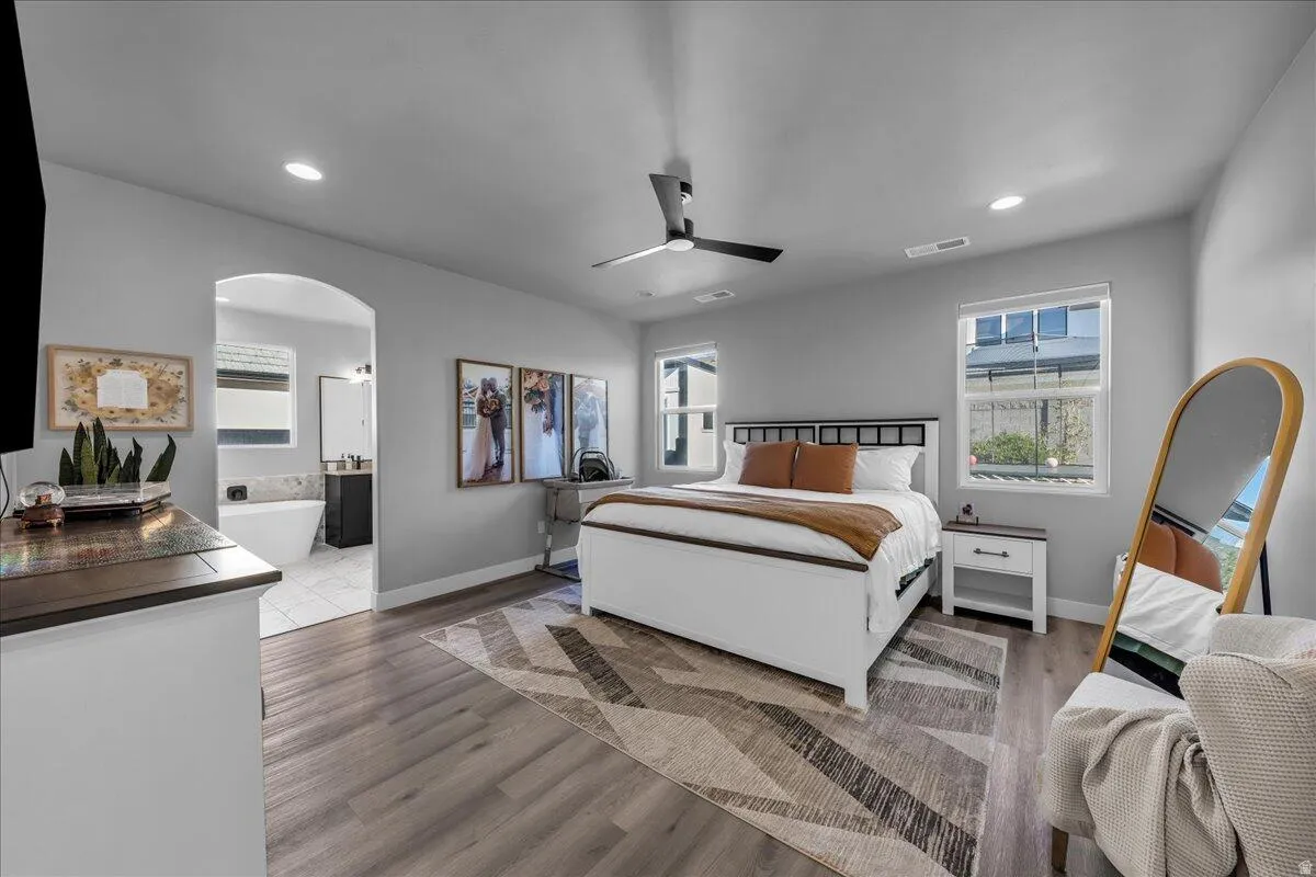 Bedroom featuring wood-finish flooring, recessed lighting, and a contemporary ceiling fan