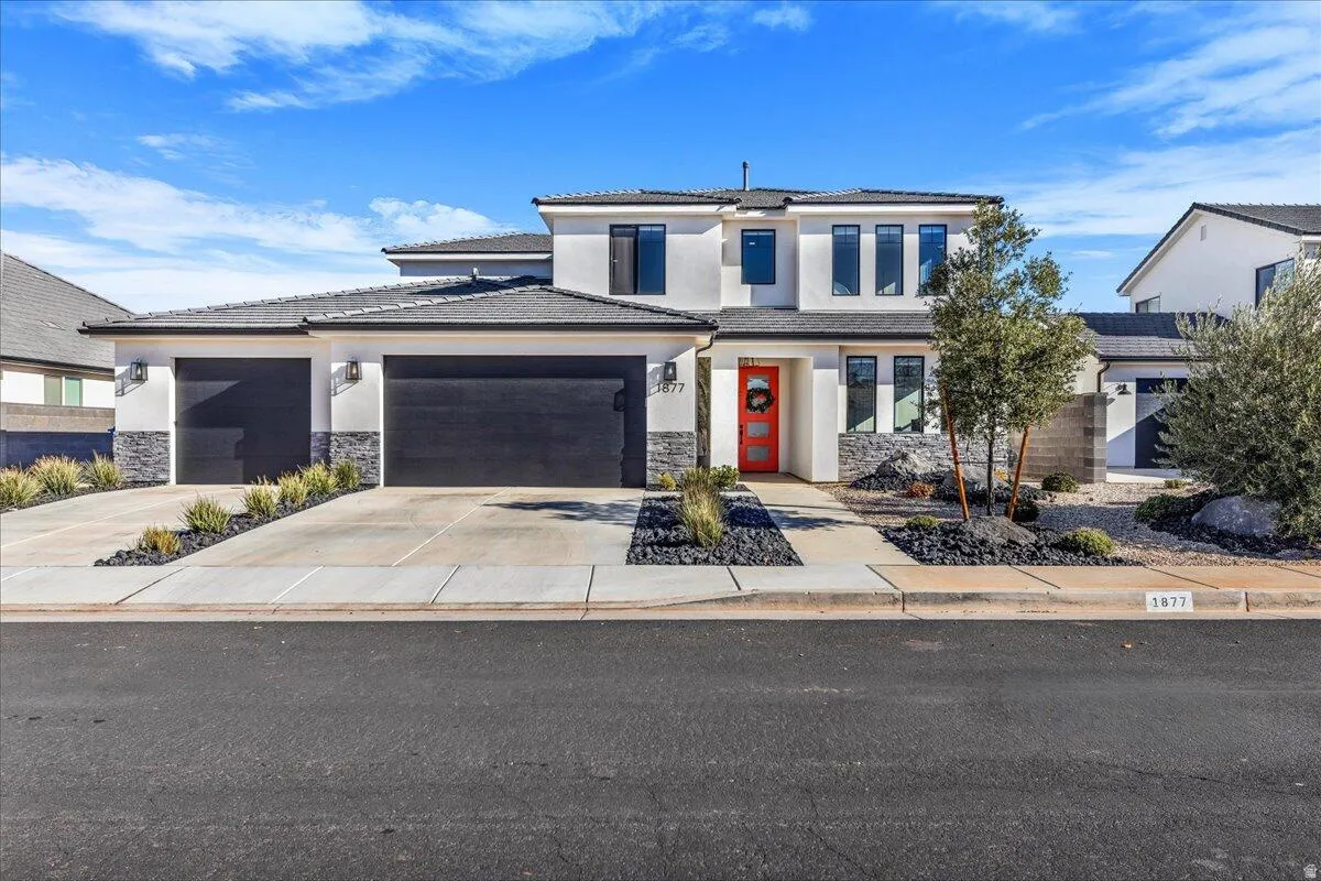 Contemporary exterior featuring stucco siding and stone accents