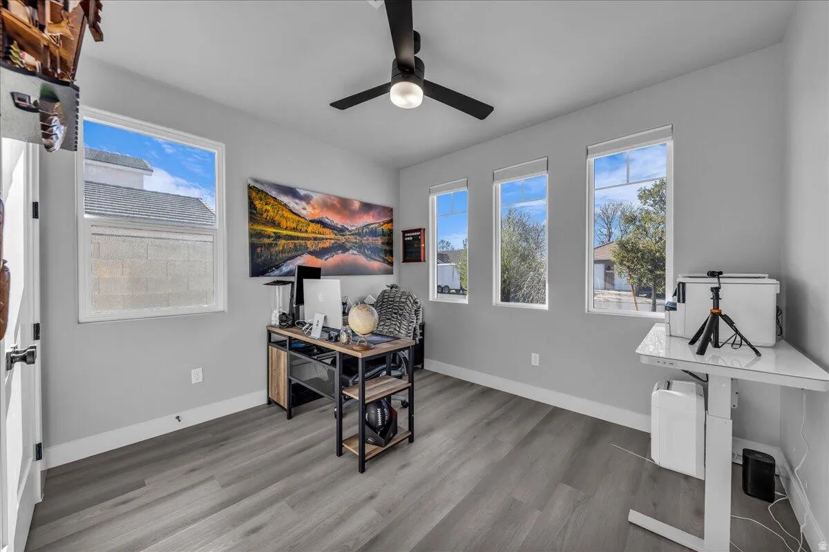 Room featuring light gray wall paint and wood-finish flooring