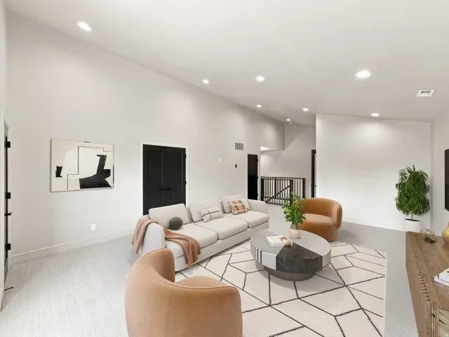 Vaulted ceilings, recessed lighting, double panel doors with matte black hardware, and wood-finish flooring