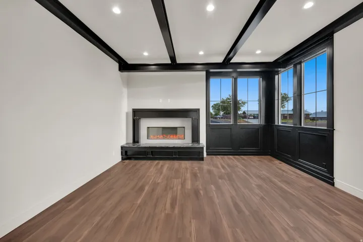 Interior space featuring dark wood-finish flooring and white walls